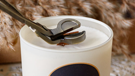 Why is a candle wick trimmer useful?